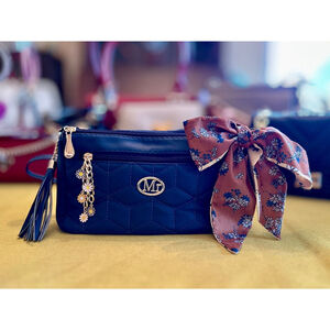 Blue accessorized Mr Puffer bag